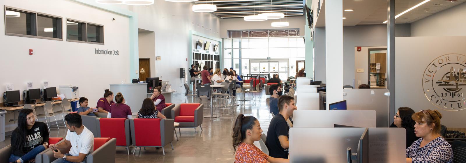 Students and staff in the Student Services building